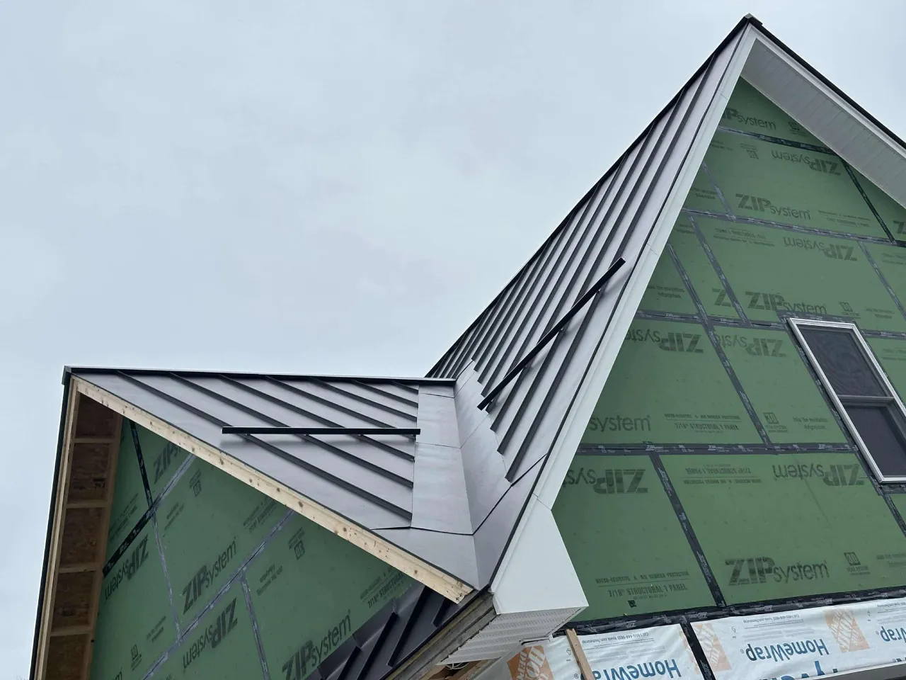Standing seam metal roof installation in Massachusetts