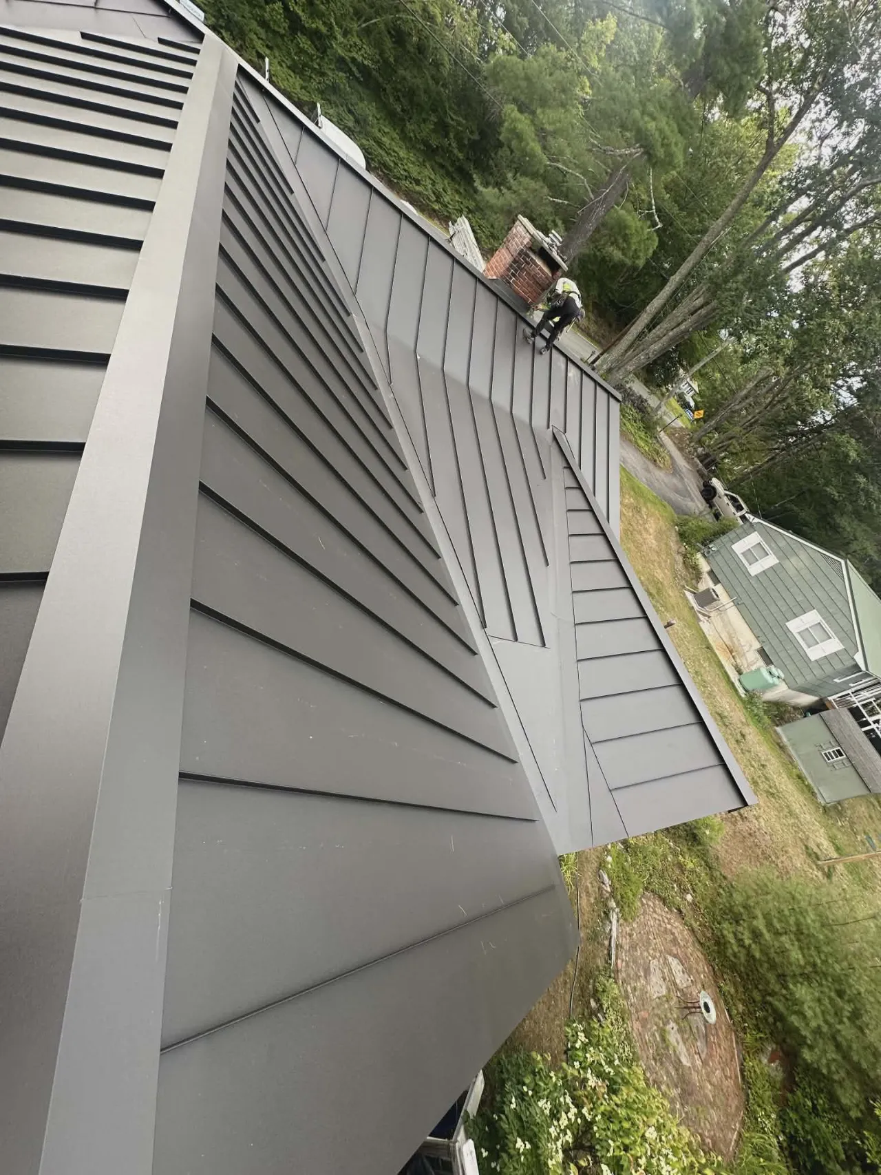 Roof replacement in progress on a home in Massachusetts