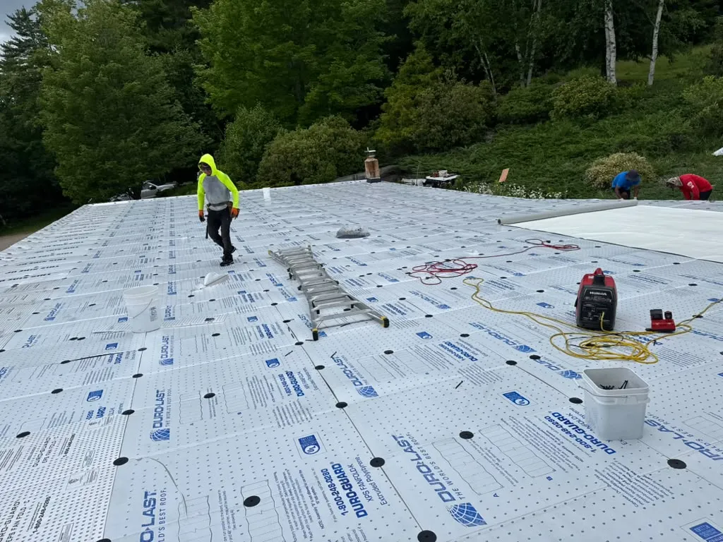 Flat roof tear off and new rubber roofing in Massachusetts