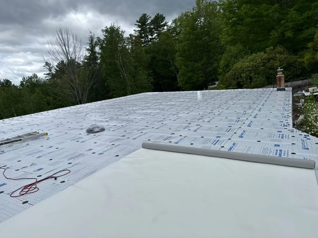 EPDM rubber roof installation on a flat roof in Massachusetts