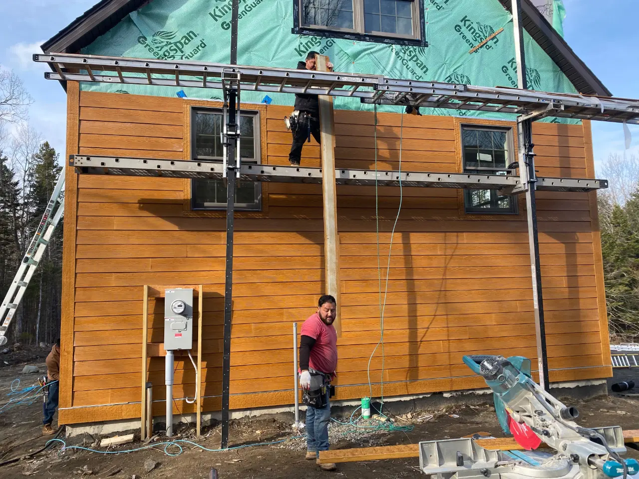 Roofing crew installing a roof in Massachusetts