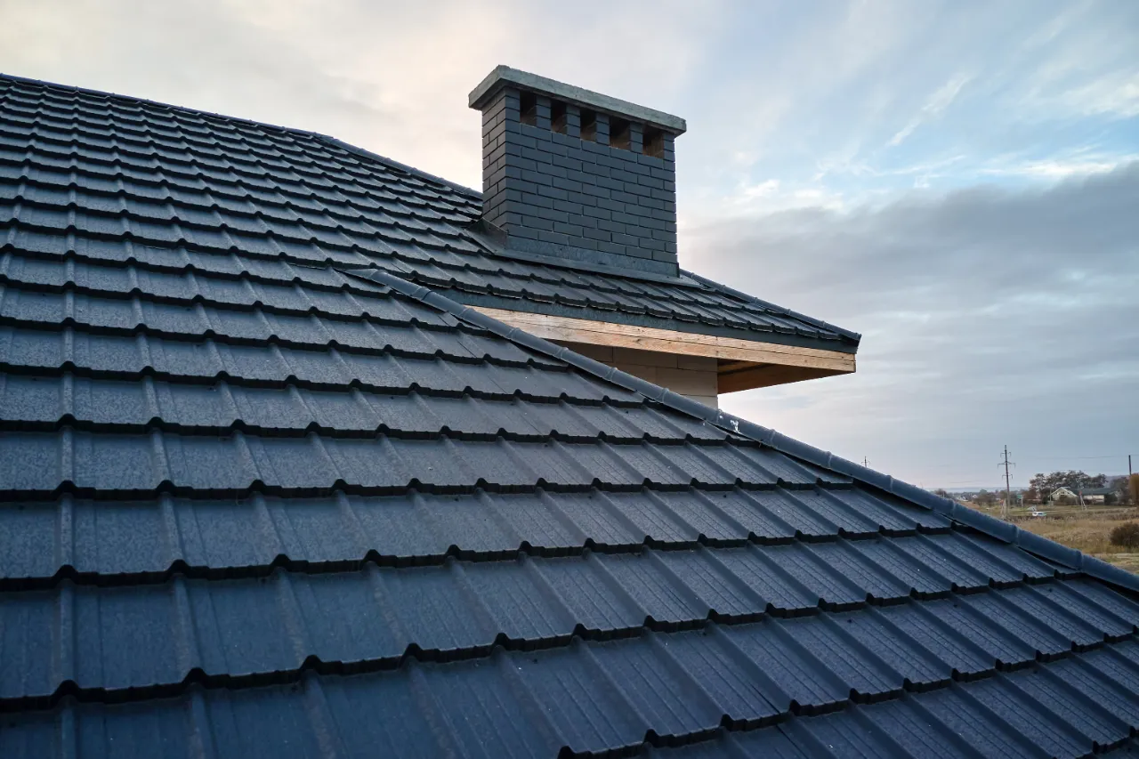 Curled and missing shingles on a roof in Massachusetts
